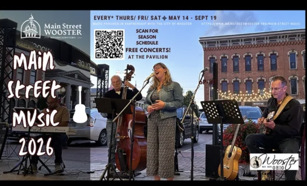 Live street band performing outdoors for Main Street Music 2016 with a singer, upright bass, keyboard and guitar.